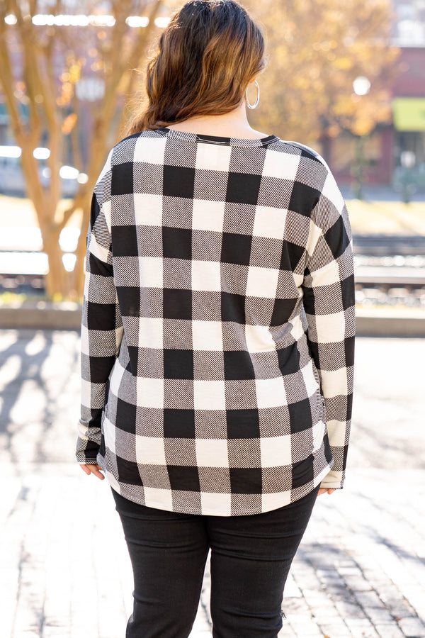 Chic Soul plus size clothing long sleeve top with black and white plaid design. It is button down in the front. 
