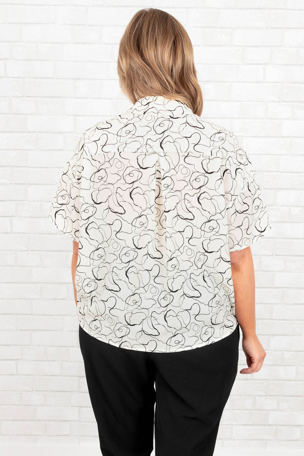 Chic Soul plus size clothing, white button down top with black abstract design and knotted hemline
