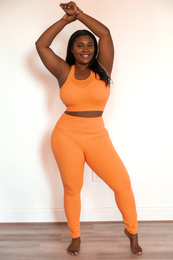 Chic Soul plus size clothing, coral orange sports bra with mesh detailing