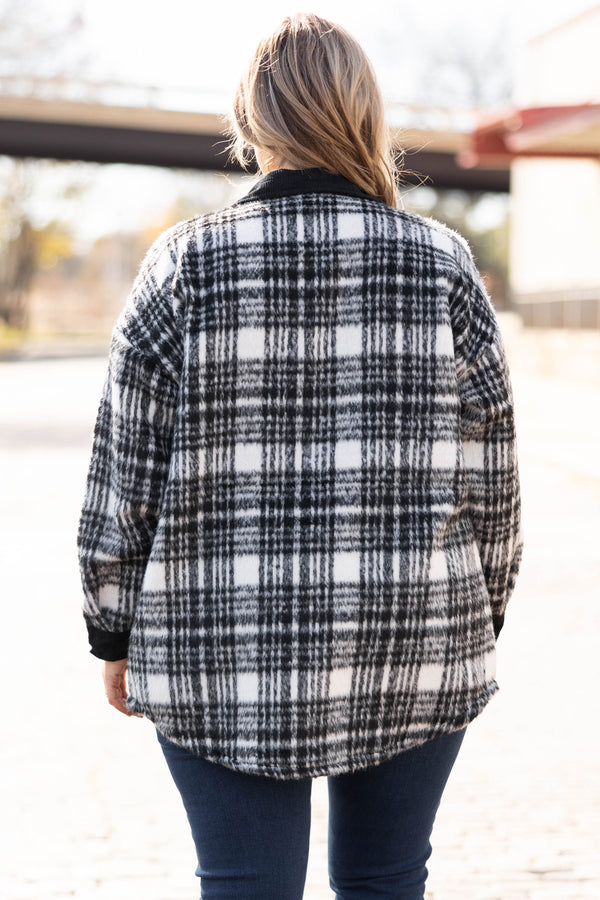 Plus Size black and white plaid shacket with a button-down front, collar, and chest pockets.