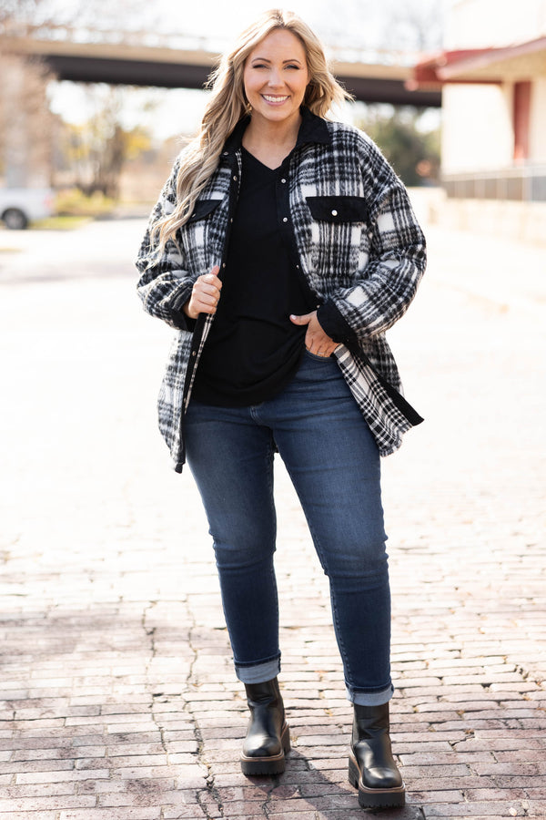 Plus Size black and white plaid shacket with a button-down front, collar, and chest pockets.