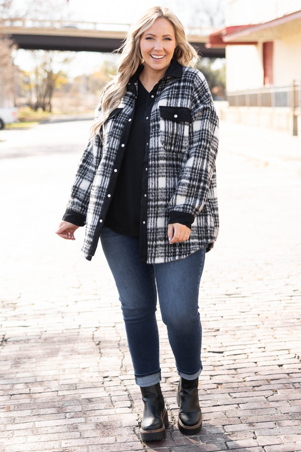 Plus Size black and white plaid shacket with a button-down front, collar, and chest pockets.
