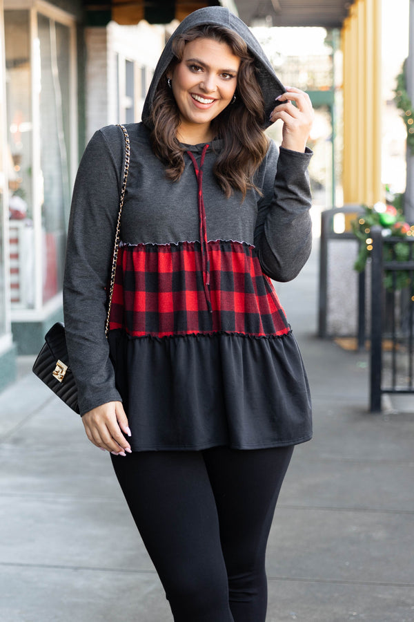 Chic Soul plus size clothing long sleeve top with a hoodie. The upper section of the shirt is in a dark gray color, the middle stripe is black and red plaid, and the lower portion is in a black color.