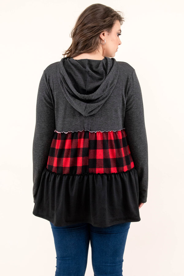 Chic Soul plus size clothing long sleeve top with a hoodie. The upper section of the shirt is in a dark gray color, the middle stripe is black and red plaid, and the lower portion is in a black color.